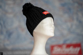 a black knit hat on a mannequin SKIWELT